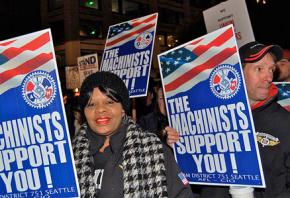 Members of IAM District 751 march in solidarity with grocery workers